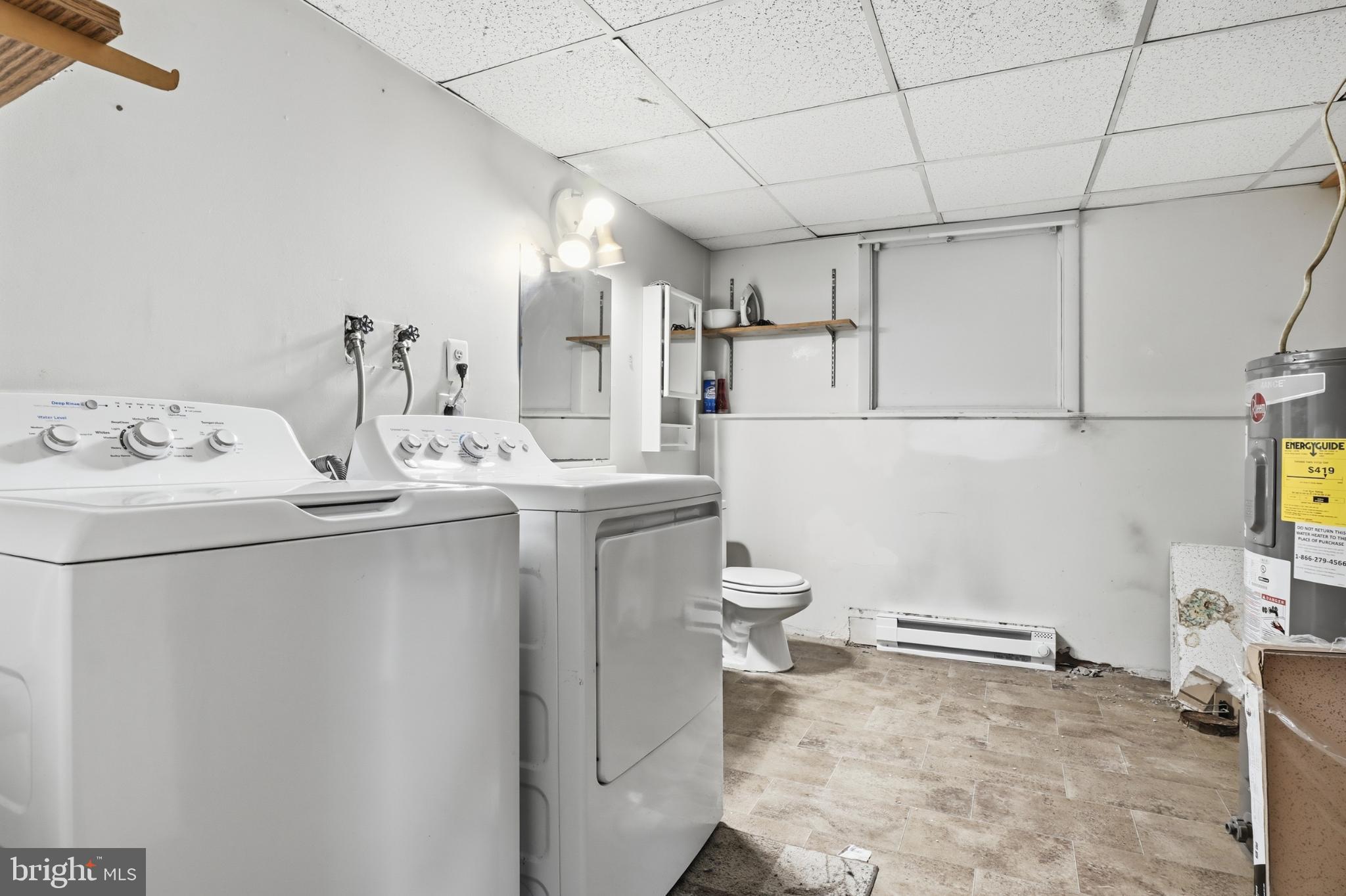 4849 Springtop Drive Harrisburg, PA 17111 - Photo 31 of 42 a room with a sink a washer and dryer