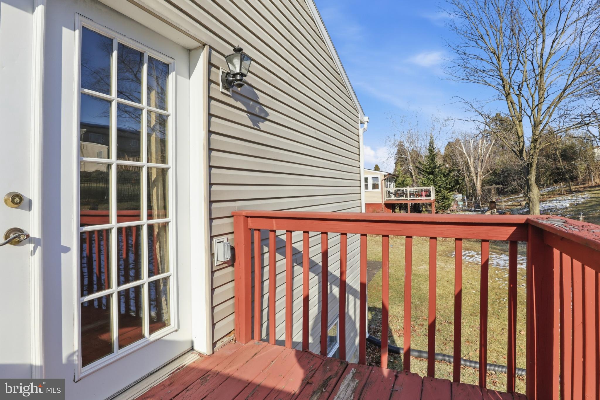 4849 Springtop Drive Harrisburg, PA 17111 - Photo 33 of 42 a porch with a bench next to a yard