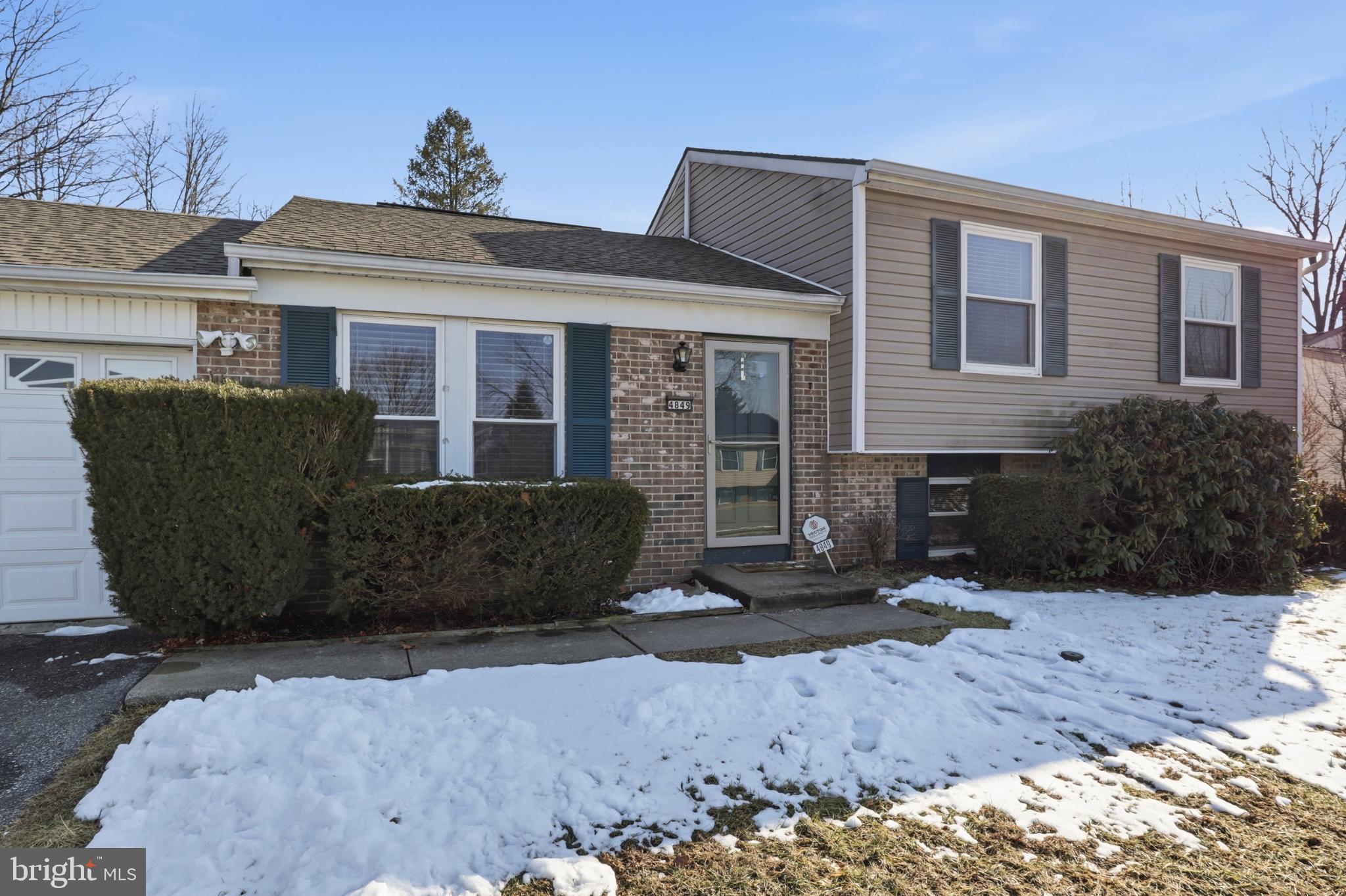 4849 Springtop Drive Harrisburg, PA 17111 - Photo 4 of 42 a front view of a house with a yard