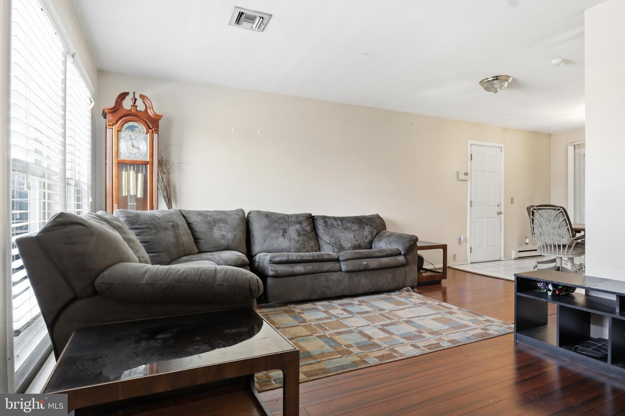 4849 Springtop Drive Harrisburg, PA 17111 - Photo 5 of 42 a living room with furniture and kitchen