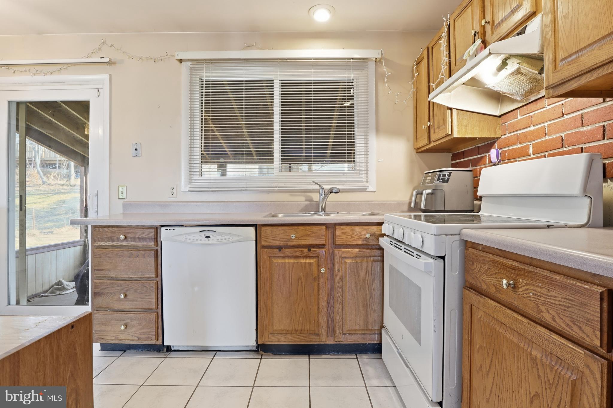 4849 Springtop Drive Harrisburg, PA 17111 - Photo 9 of 42 a kitchen with a sink stove and cabinets