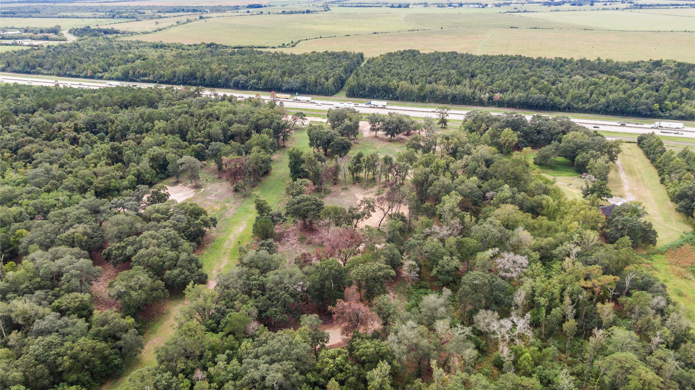 31901 Interstate 10 Hankamer, TX 77560 - Photo 5 of 12 a view of a lake with a yard and mountain