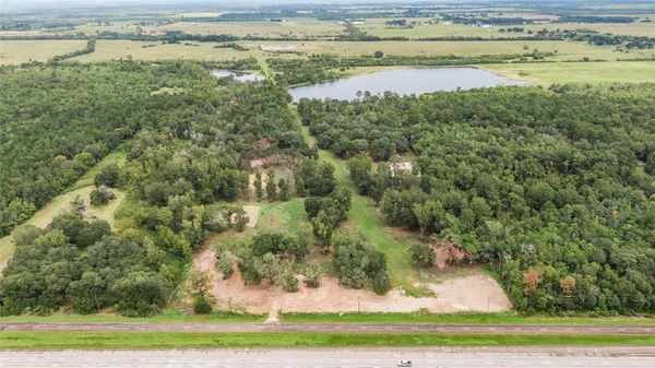 a view of a lake with a yard