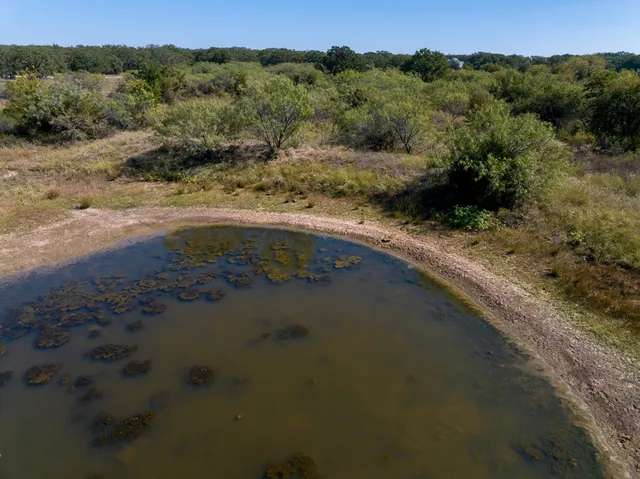 an aerial view of residential house with outdoor space