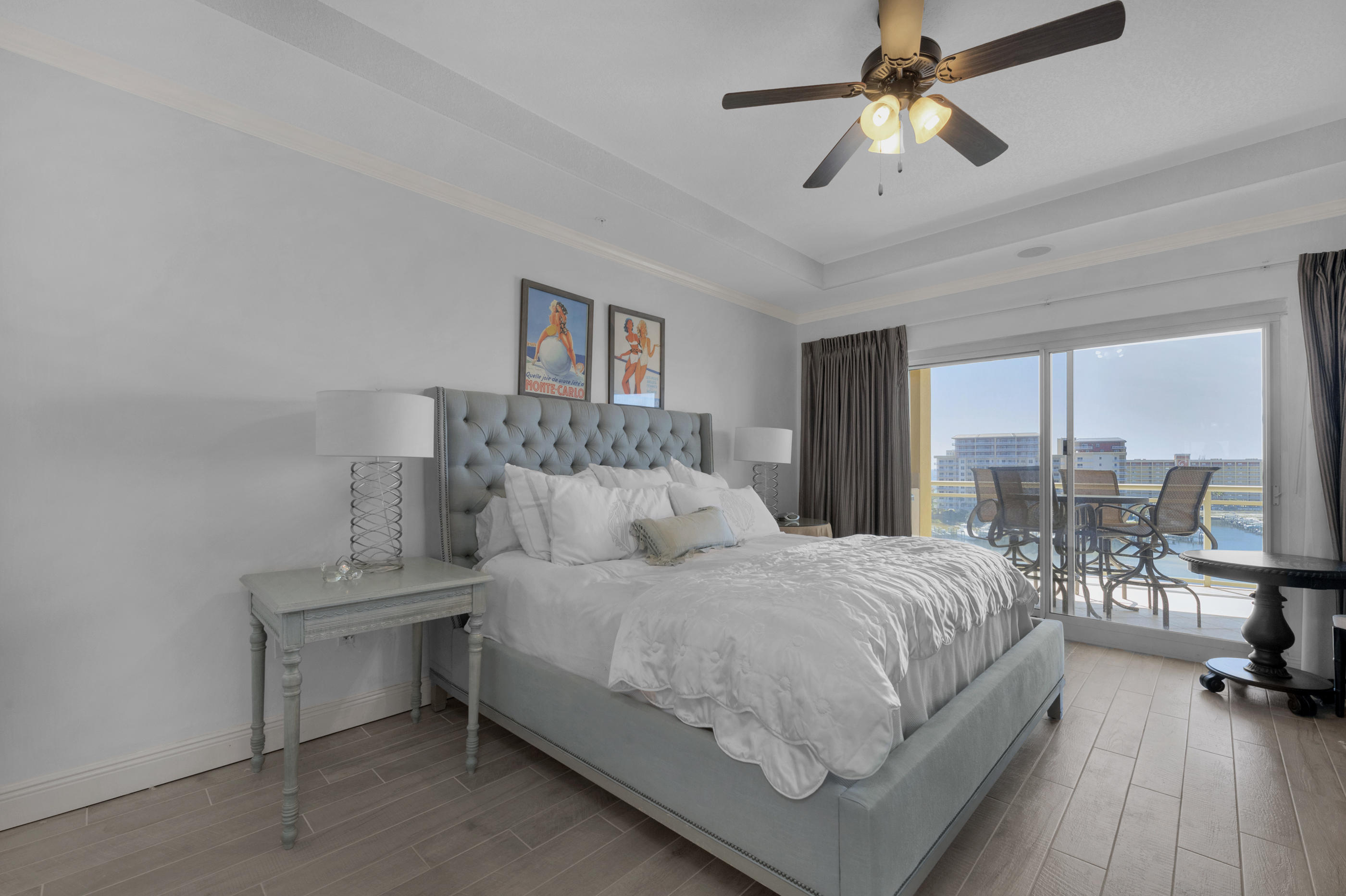 770 Harbor Boulevard, Unit 7E Destin, FL 32541 - Photo 13 of 38 a bedroom with a bed a large window and furniture