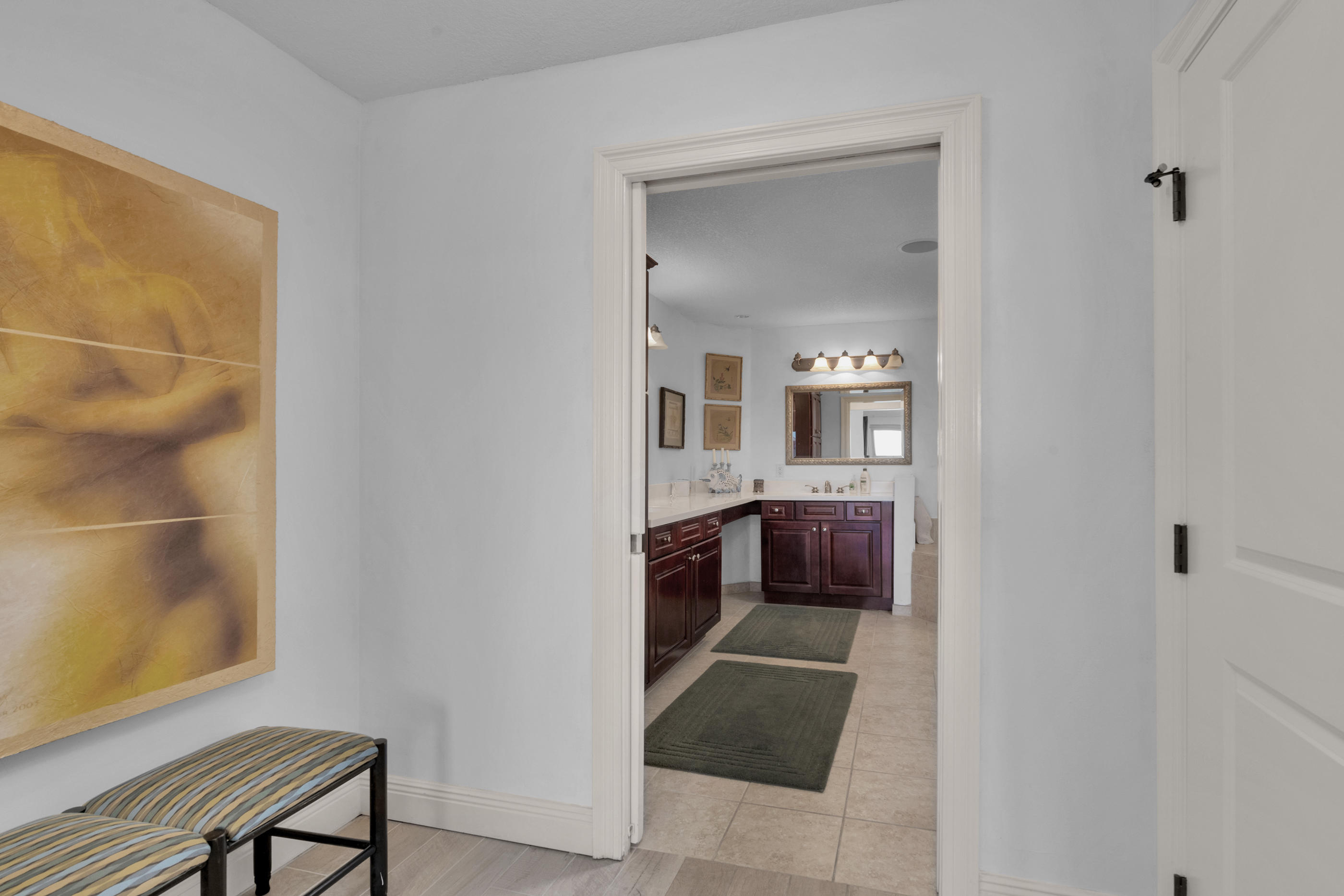 770 Harbor Boulevard, Unit 7E Destin, FL 32541 - Photo 15 of 38 a en suite bathroom with a sink and a mirror