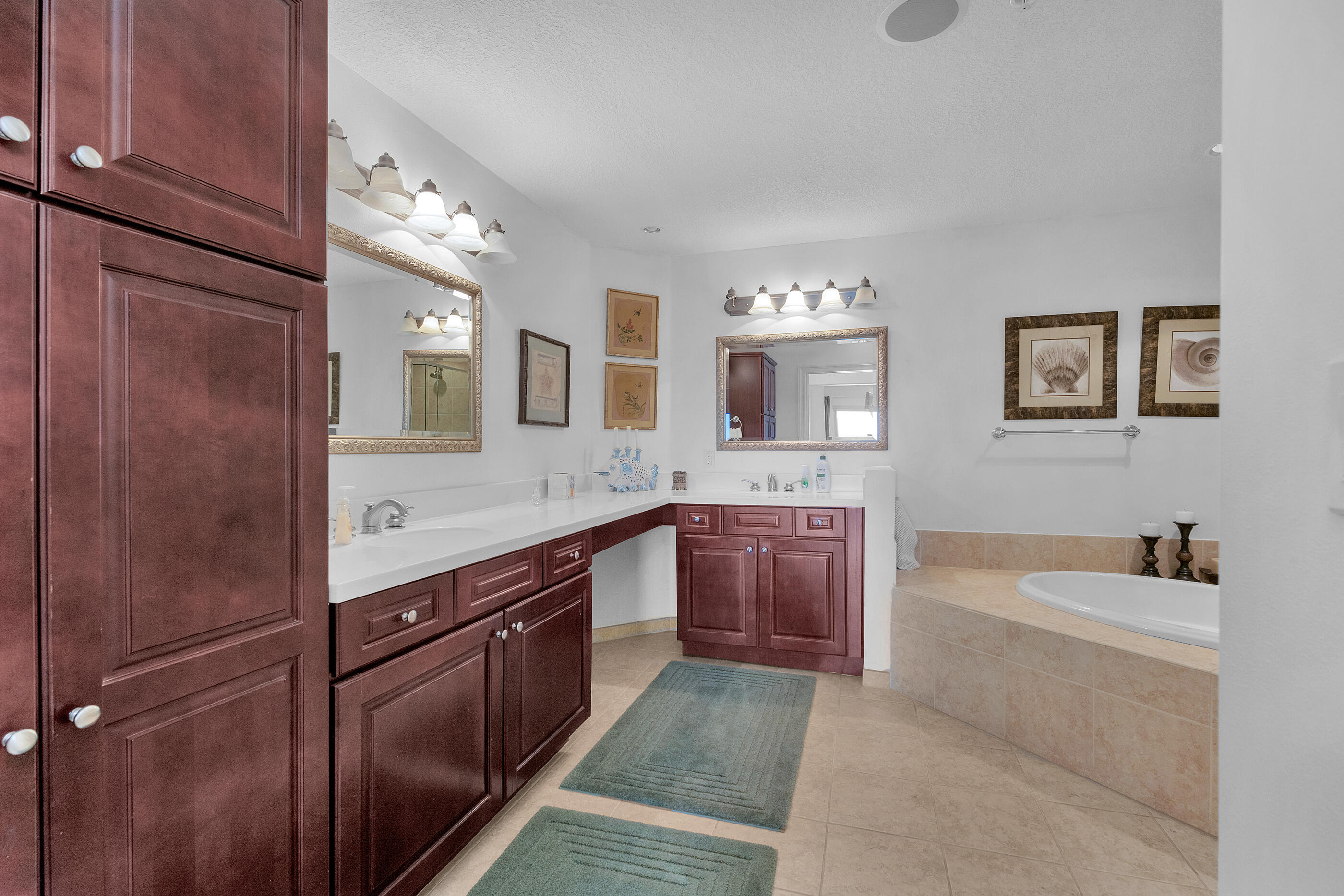 770 Harbor Boulevard, Unit 7E Destin, FL 32541 - Photo 16 of 38 a spacious bathroom with a granite countertop sink mirror and bathtub