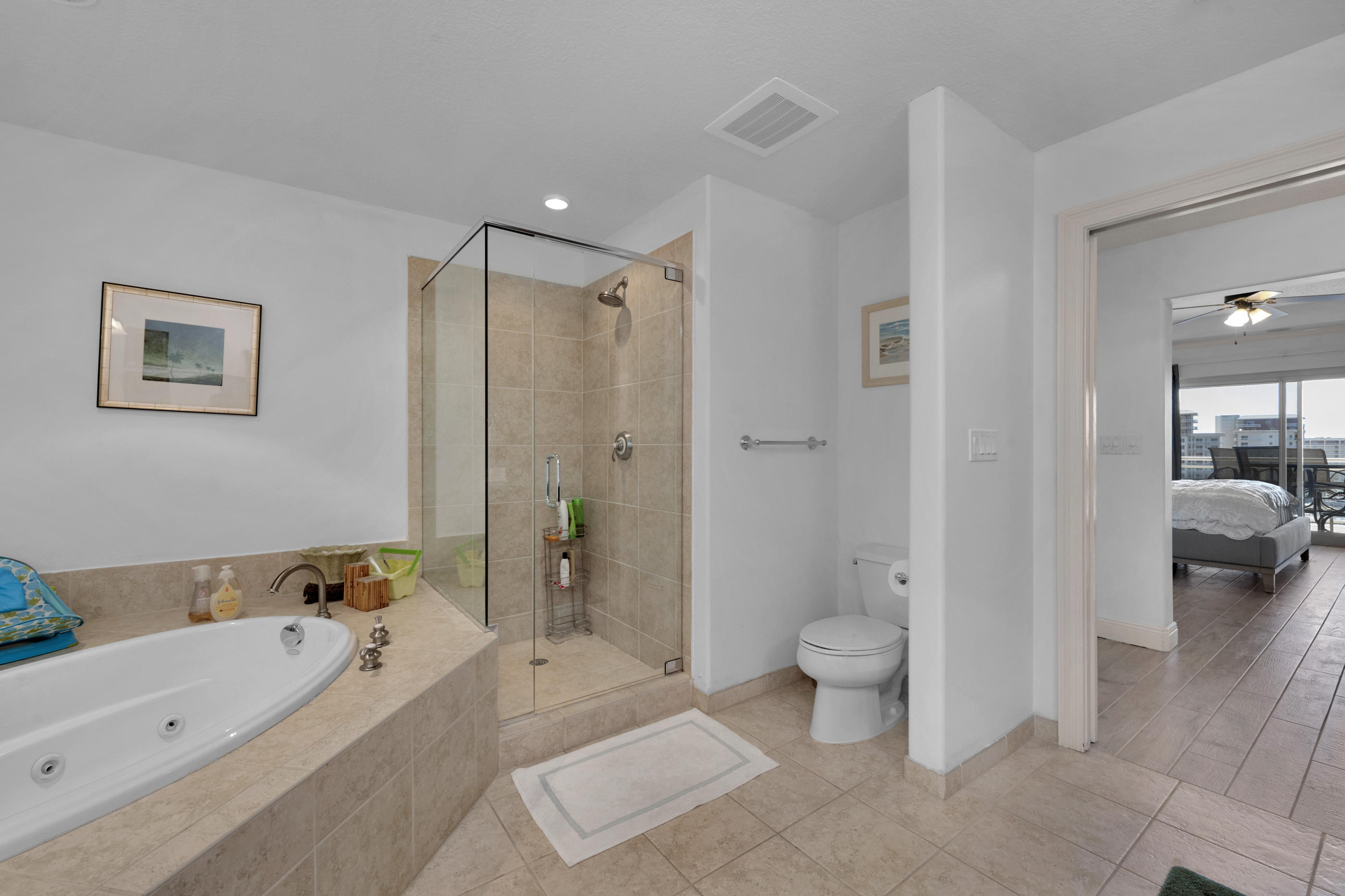 770 Harbor Boulevard, Unit 7E Destin, FL 32541 - Photo 17 of 38 a bathroom with a tub toilet and a tub