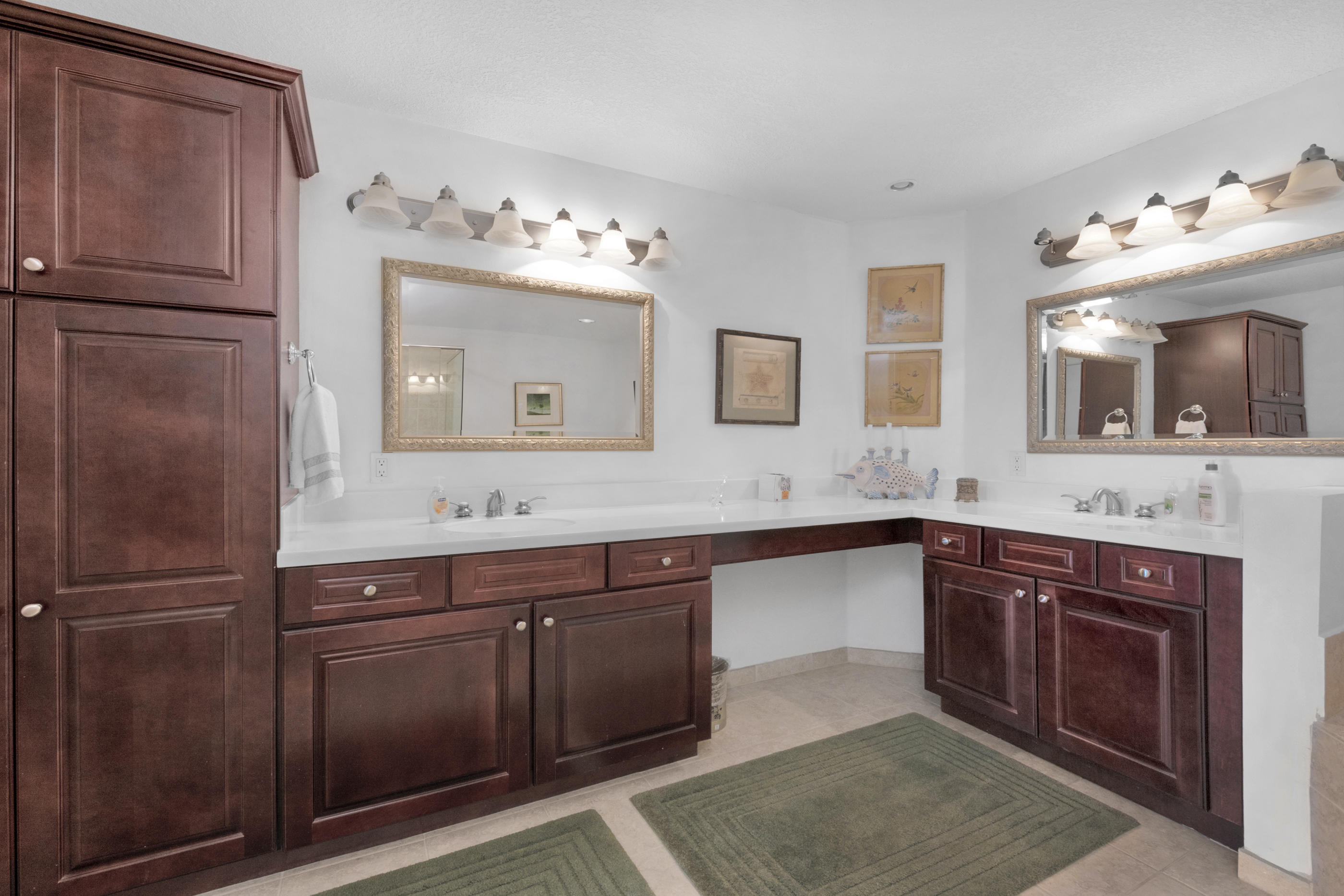 770 Harbor Boulevard, Unit 7E Destin, FL 32541 - Photo 18 of 38 a spacious bathroom with a sink vanity and mirror