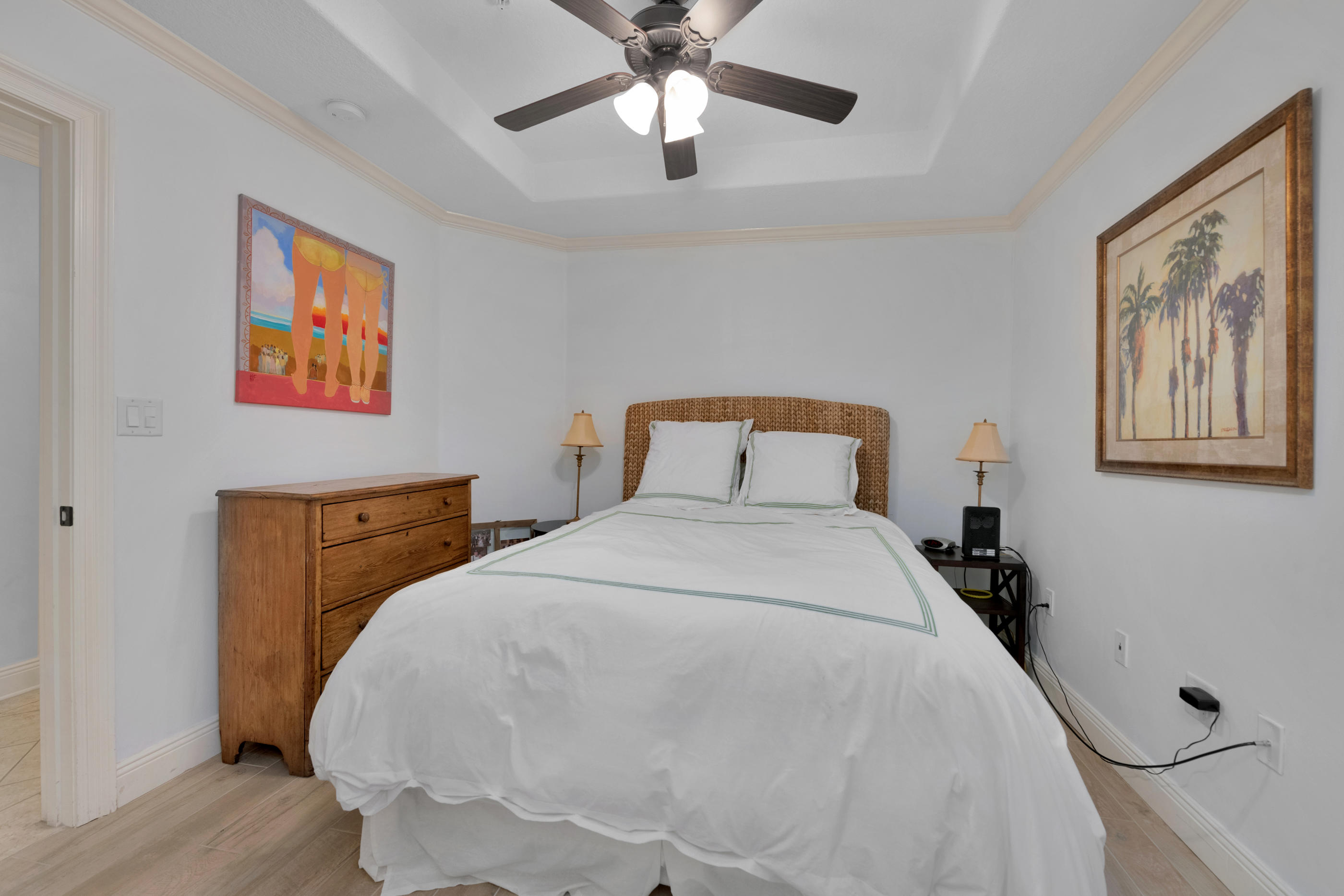 770 Harbor Boulevard, Unit 7E Destin, FL 32541 - Photo 22 of 38 a bedroom with a bed and a chandelier