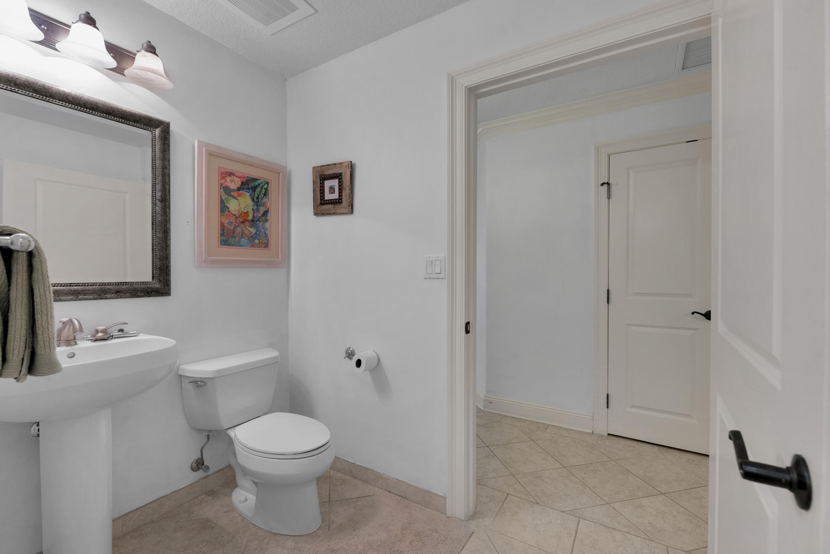 770 Harbor Boulevard, Unit 7E Destin, FL 32541 - Photo 25 of 38 a bathroom with a toilet sink and shower