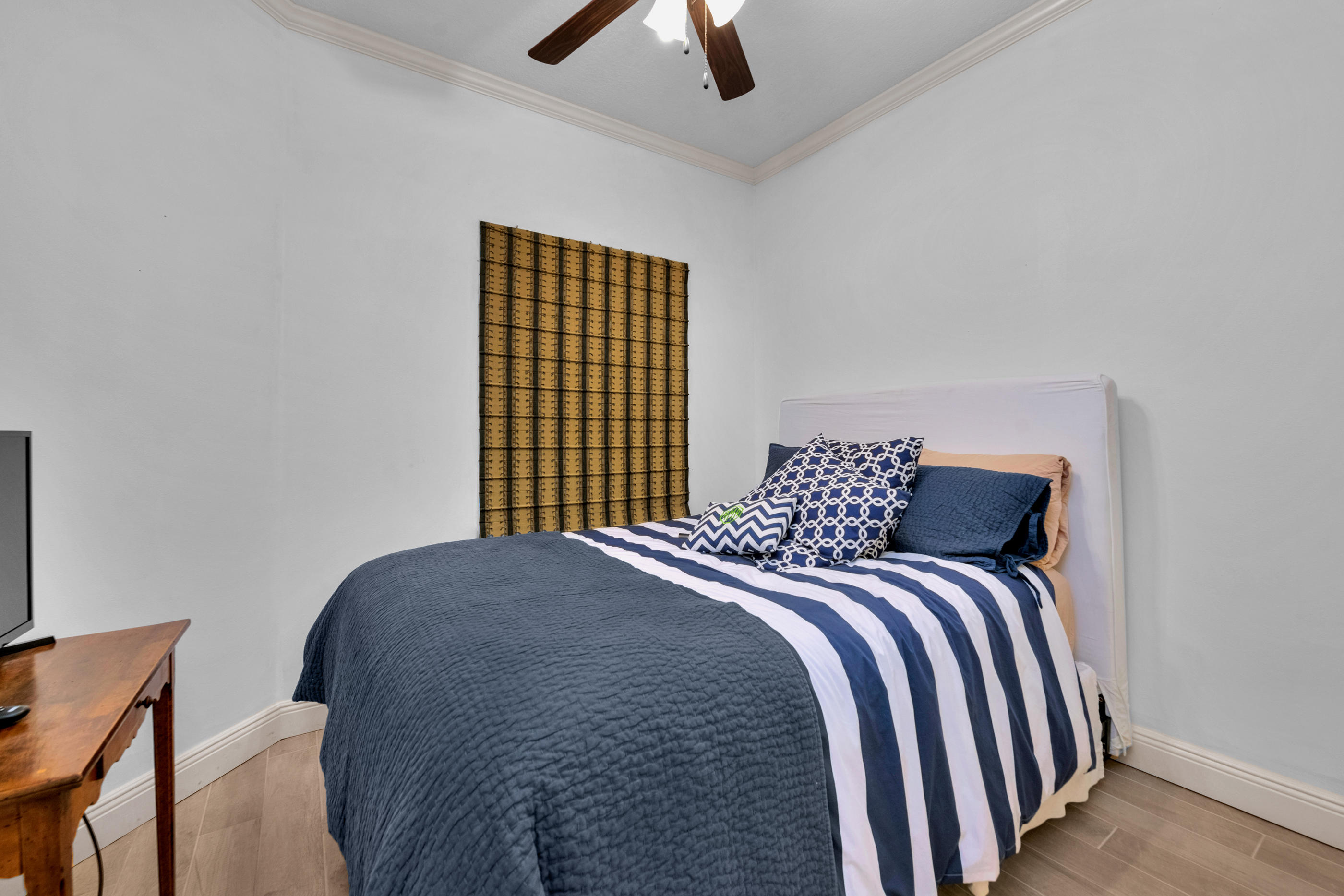 770 Harbor Boulevard, Unit 7E Destin, FL 32541 - Photo 27 of 38 a large bed sitting in a bedroom next to a window