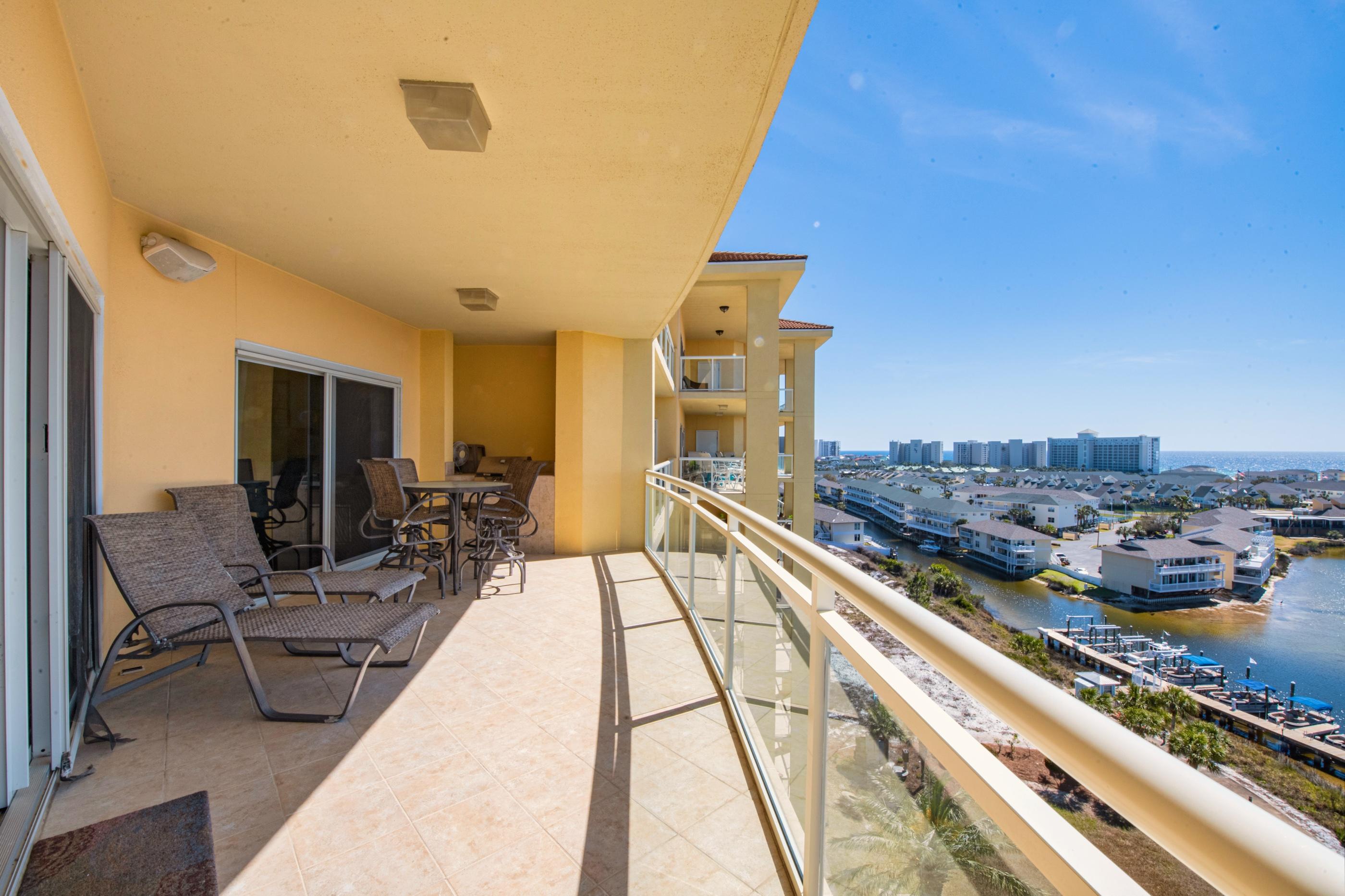 770 Harbor Boulevard, Unit 7E Destin, FL 32541 - Photo 29 of 38 a view of a balcony with chairs