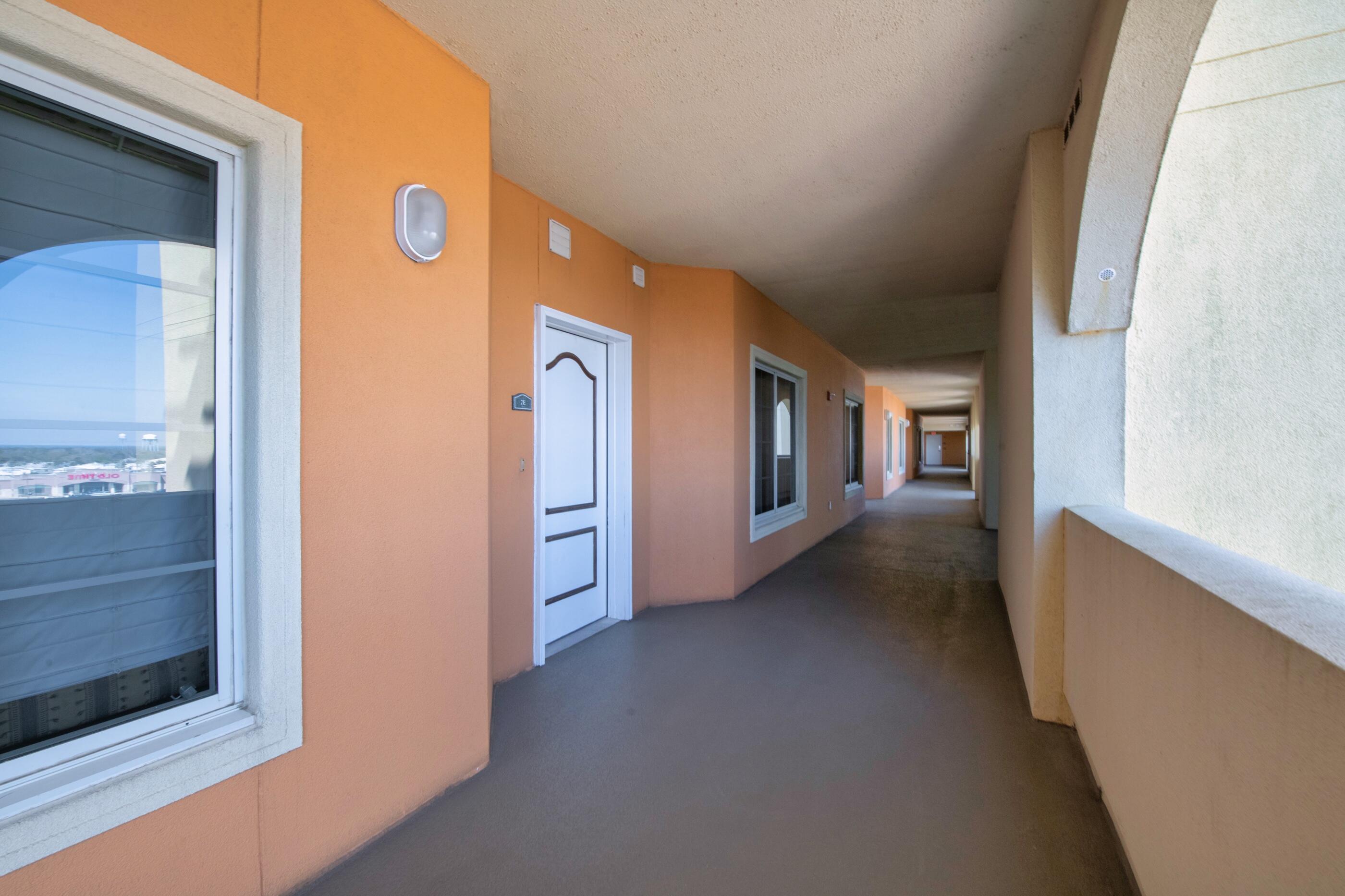 770 Harbor Boulevard, Unit 7E Destin, FL 32541 - Photo 35 of 38 a view of a hallway with windows