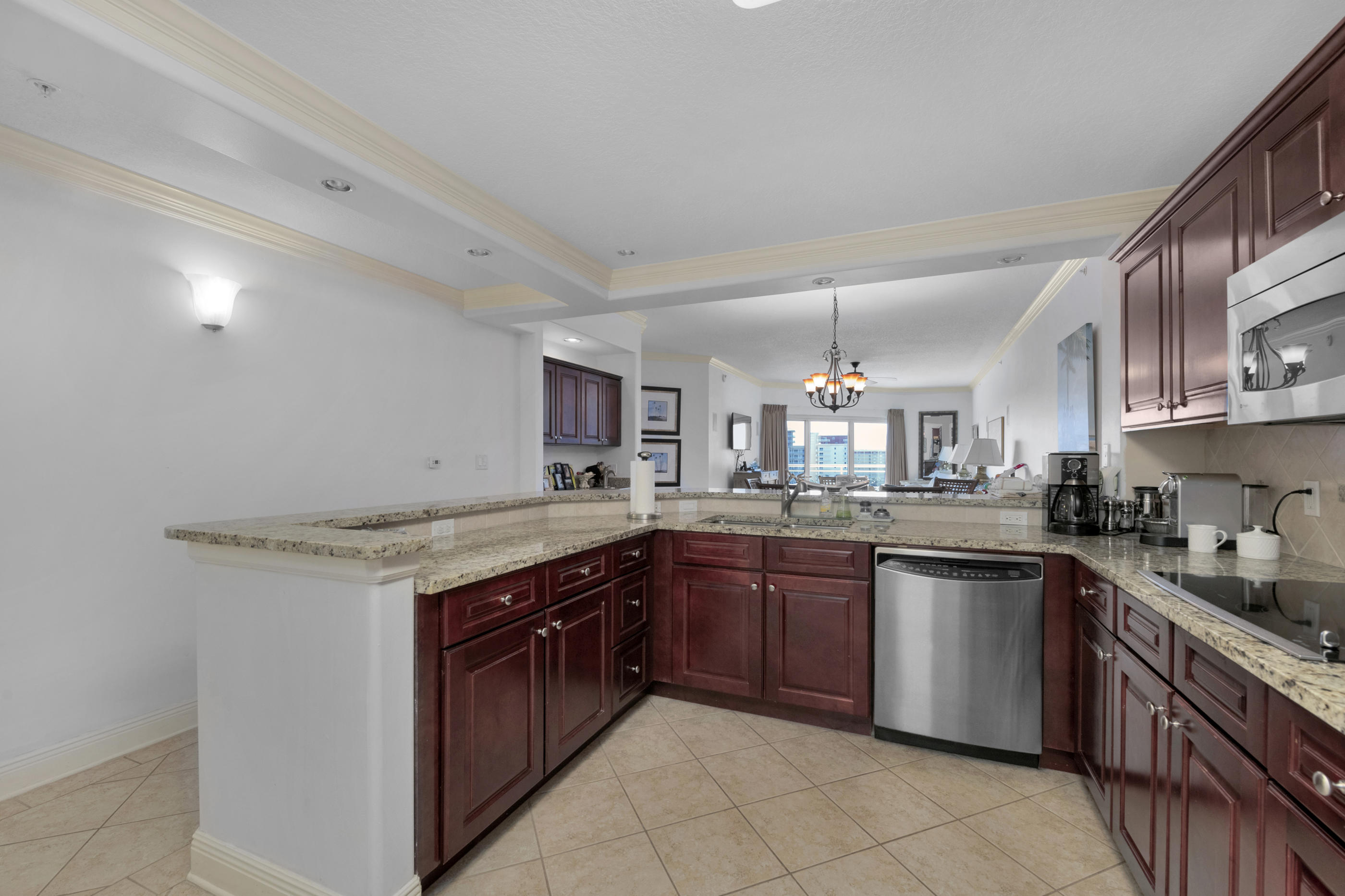 770 Harbor Boulevard, Unit 7E Destin, FL 32541 - Photo 8 of 38 a kitchen with a sink stove and cabinets