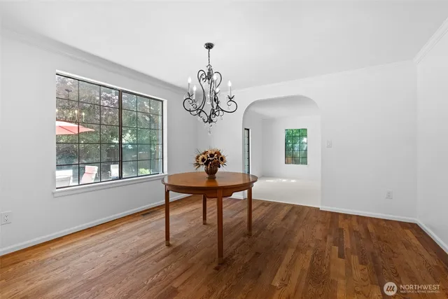 a view of a livingroom with a fireplace and window