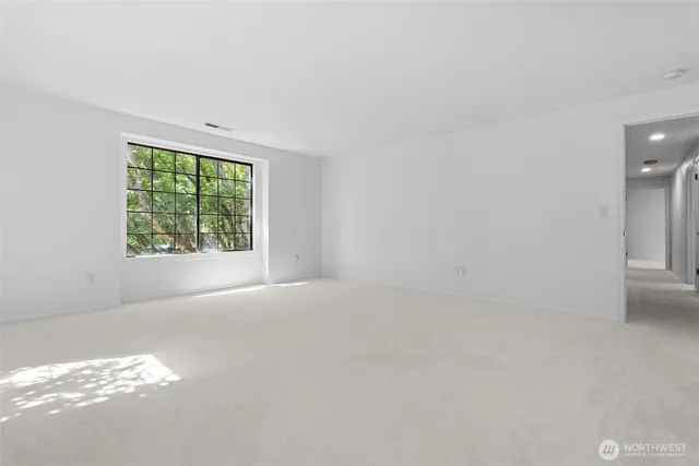 a bathroom with a tub sink vanity granite and shower