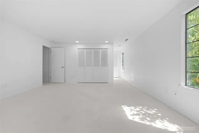 an empty room with closet area
