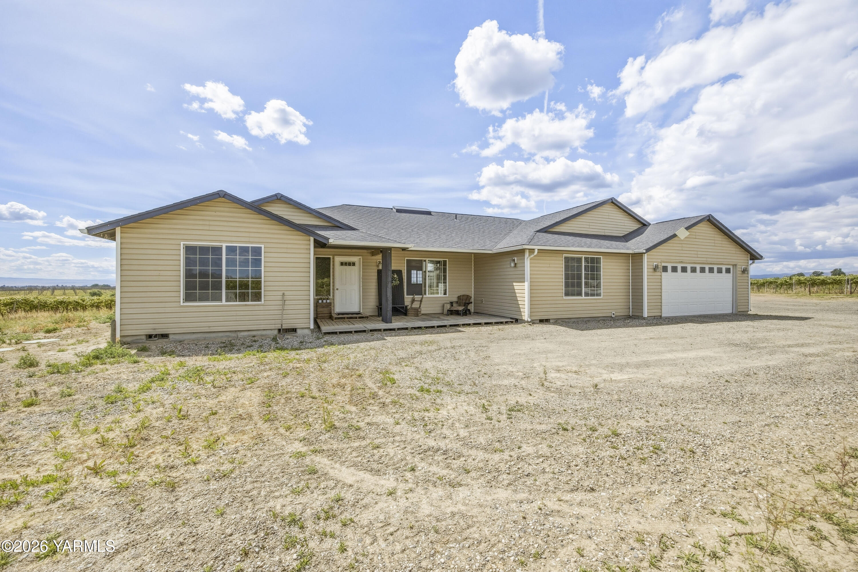 2050 Olmstead Road Grandview, WA 98930 - Photo 17 of 60 a view of a house with a yard and chandelier