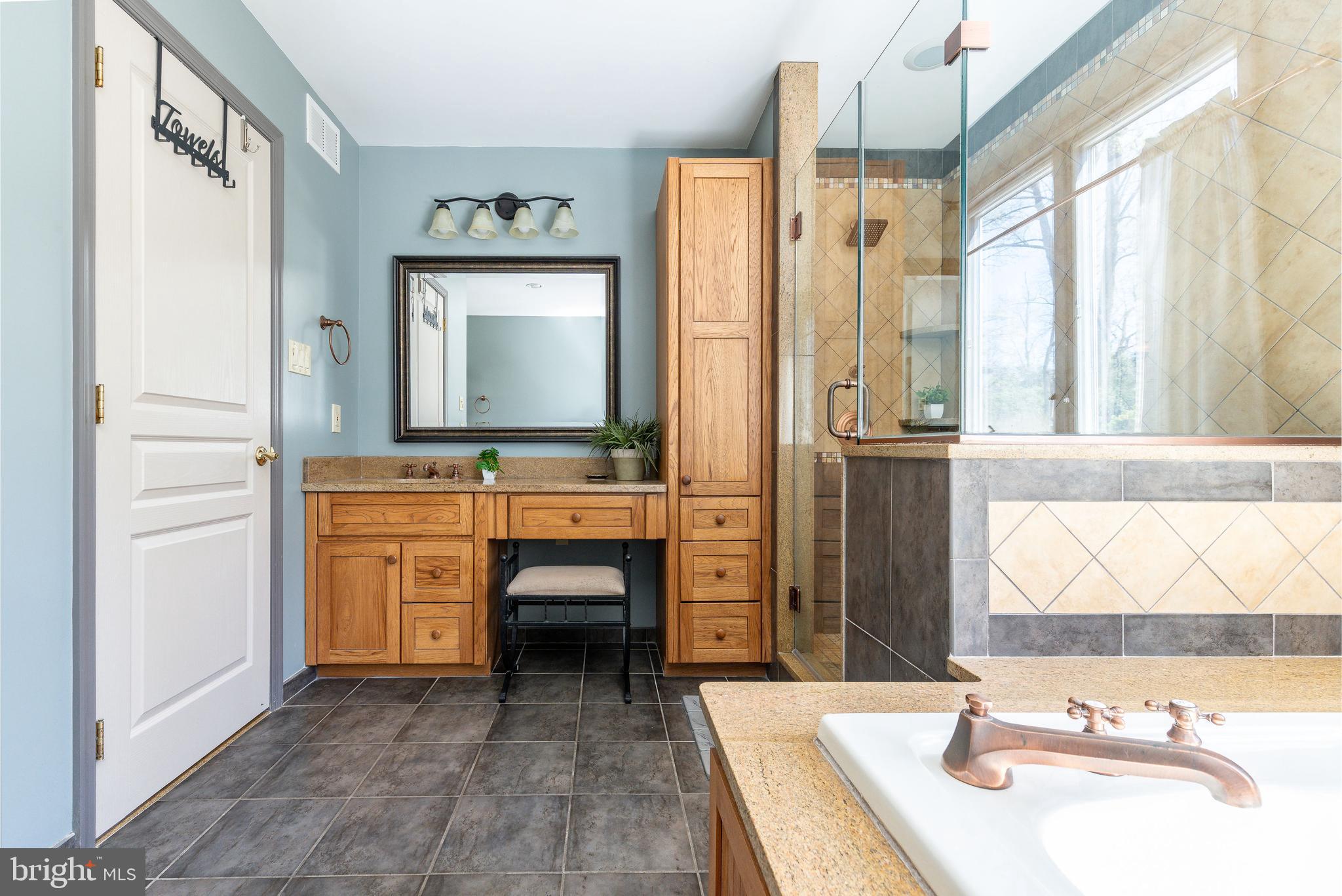 583 Lake Boulevard Lindenwold, NJ 08021 - Photo 24 of 51 a bathroom with a sink a mirror and a bathtub