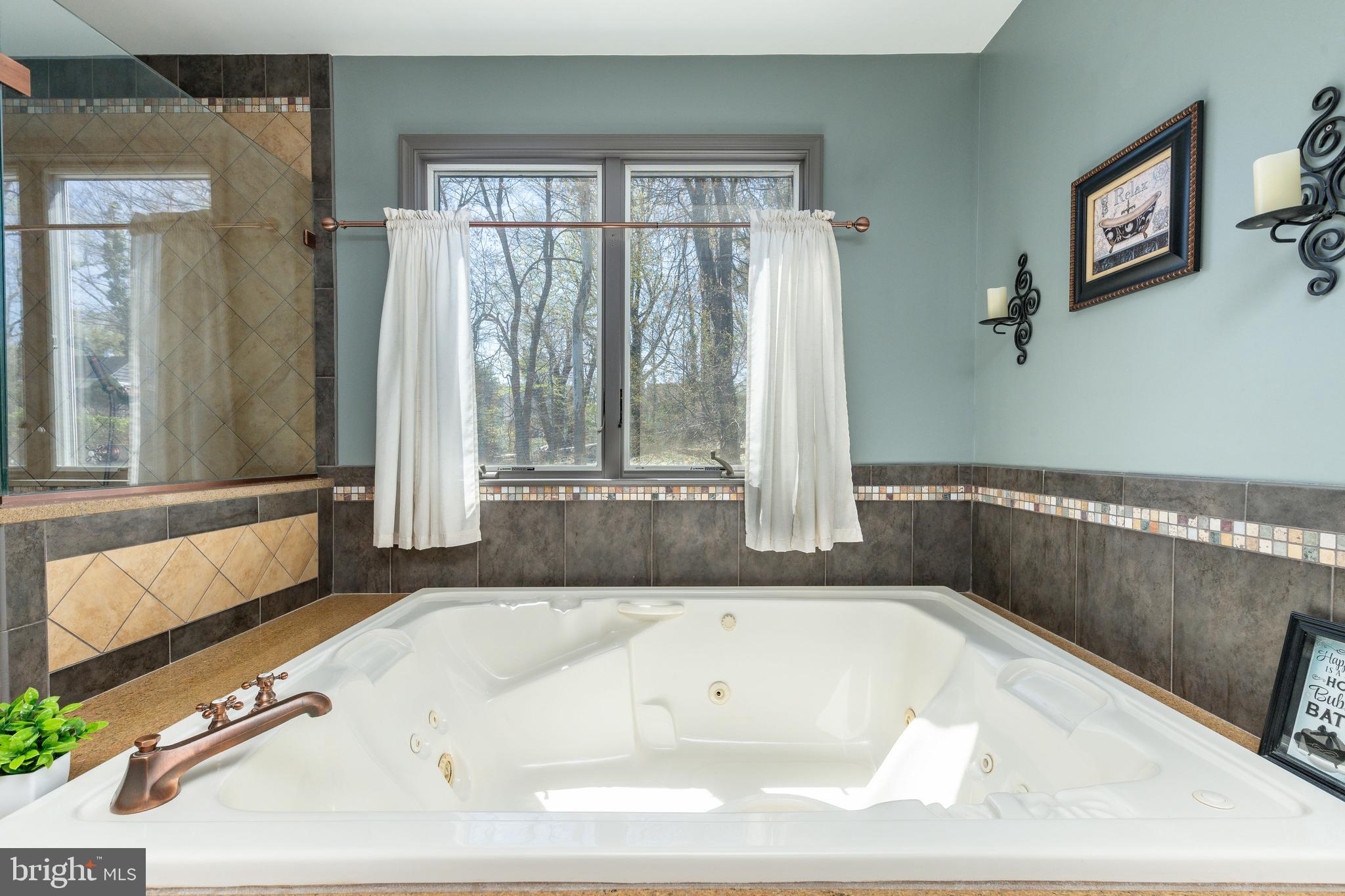 583 Lake Boulevard Lindenwold, NJ 08021 - Photo 26 of 51 a bathroom with a tub and large window
