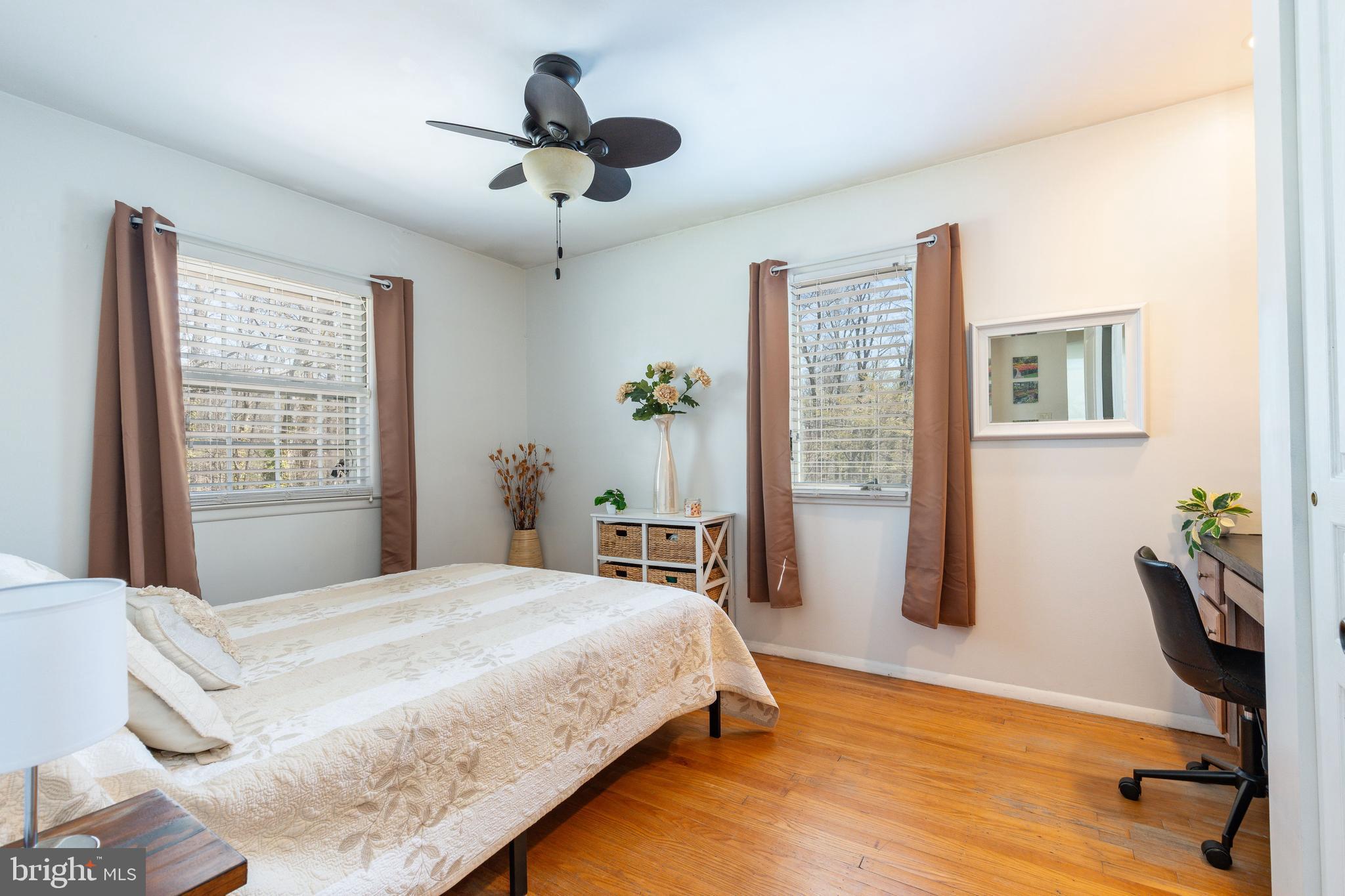 583 Lake Boulevard Lindenwold, NJ 08021 - Photo 28 of 51 a bedroom with a bed a table and a chandelier