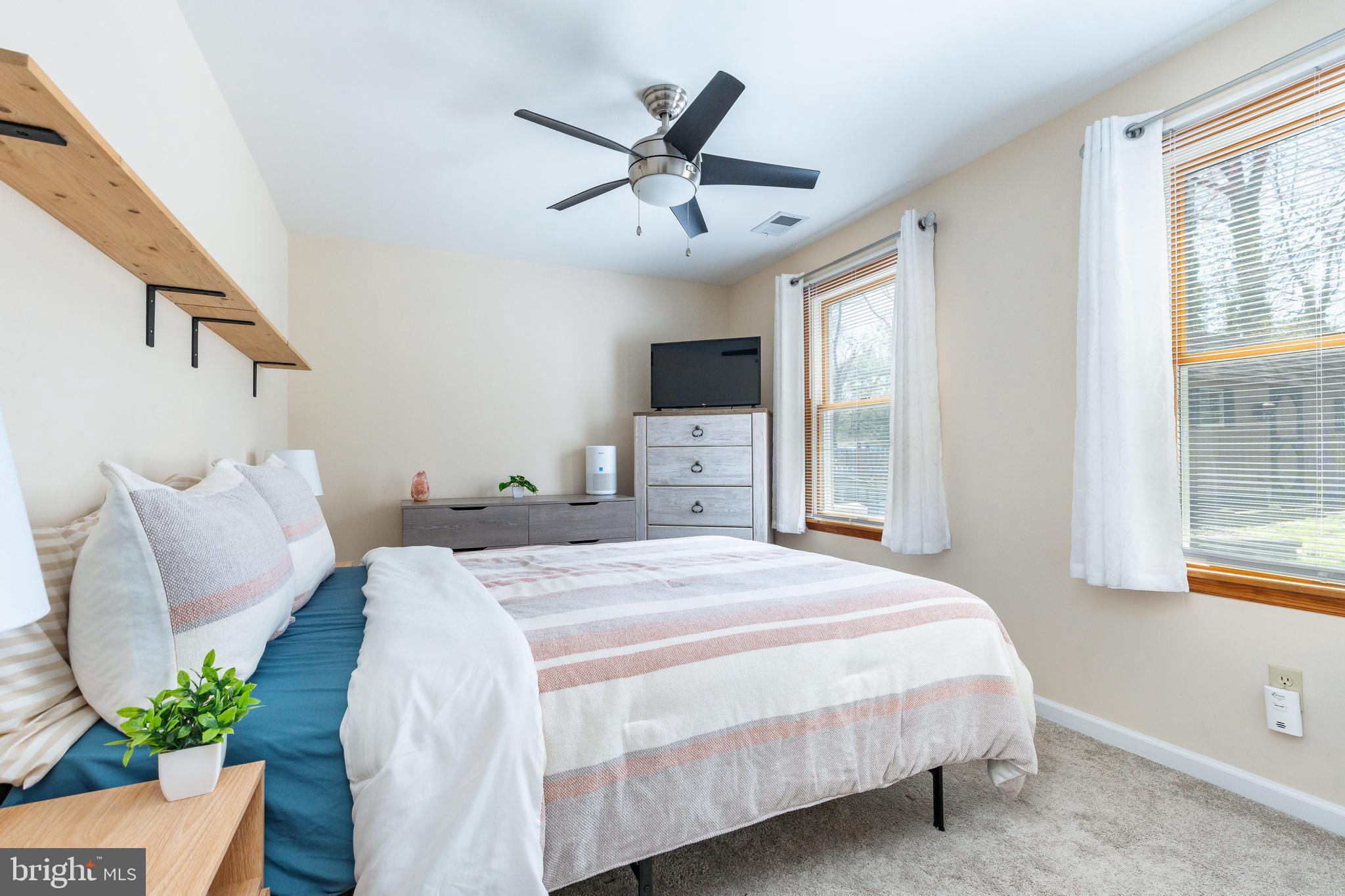 583 Lake Boulevard Lindenwold, NJ 08021 - Photo 43 of 51 a bedroom with a large bed and a window