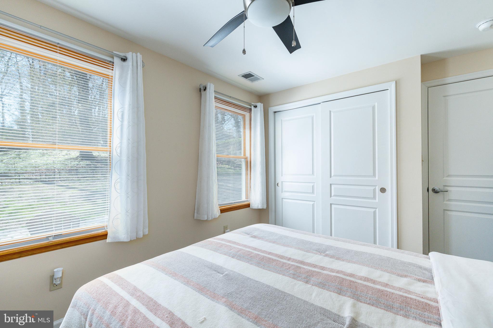 583 Lake Boulevard Lindenwold, NJ 08021 - Photo 44 of 51 a bedroom with a bed and a large window