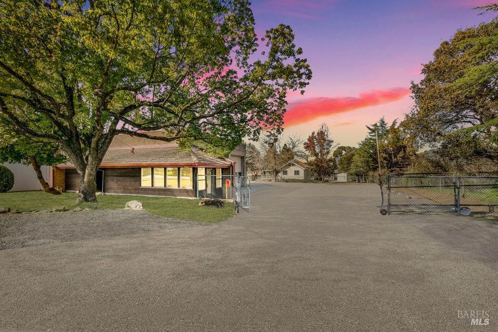 a view of house with outdoor space and tree s