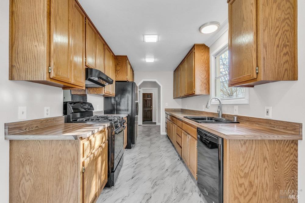 4785 Highway 12 Santa Rosa, CA 95409 - Photo 21 of 80 a kitchen with stainless steel appliances granite countertop a stove a sink dishwasher and a refrigerator