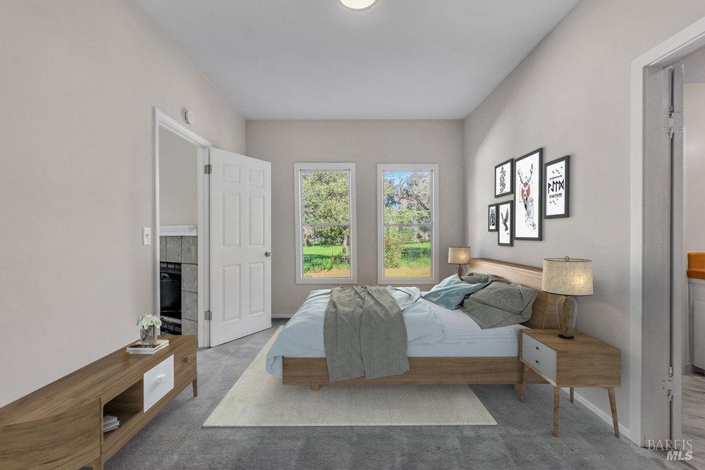 4785 Highway 12 Santa Rosa, CA 95409 - Photo 22 of 80 a spacious bedroom with a bed and a window