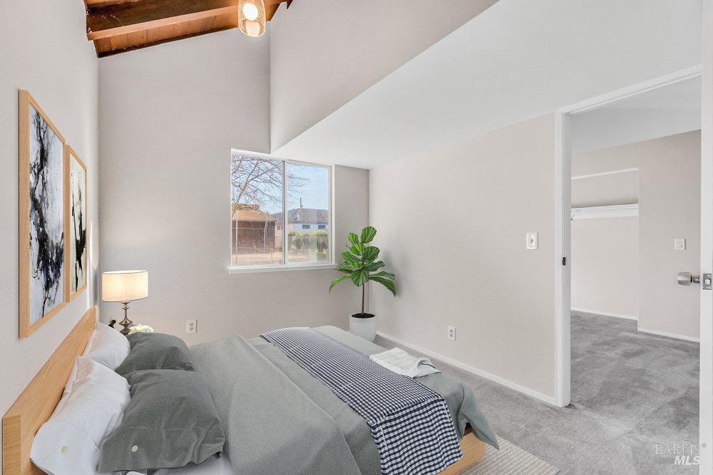 4785 Highway 12 Santa Rosa, CA 95409 - Photo 30 of 80 a bedroom with a bed and a potted plant