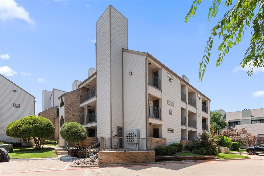 6108 Abrams Road, Unit 521 Dallas, TX 75231 - Photo 1 of 20 Three-story multi-unit building featuring white siding and brick accents