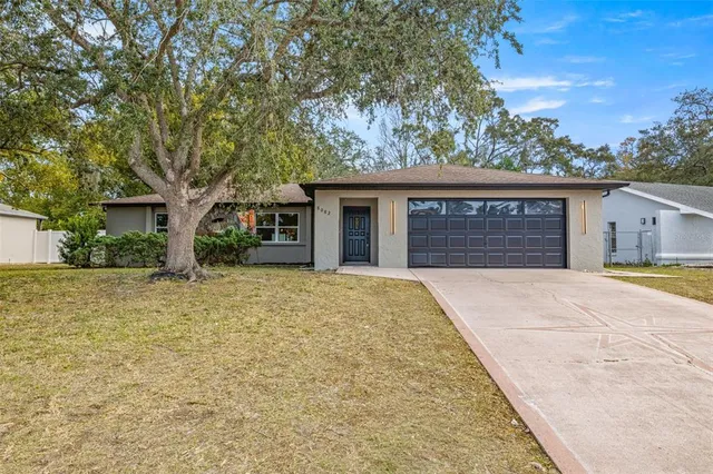 front view of a house with a yard