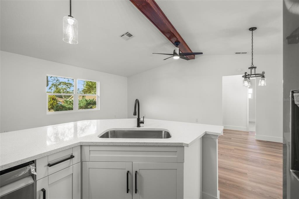 8082 Pagoda Drive Spring Hill, FL 34606 - Photo 11 of 28 a view of hallway with sink and wooden floor