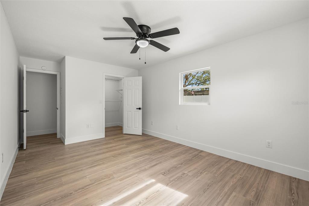 8082 Pagoda Drive Spring Hill, FL 34606 - Photo 13 of 28 a view of empty room with wooden floor