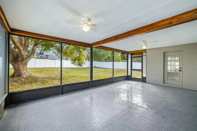 a view of an empty room with windows