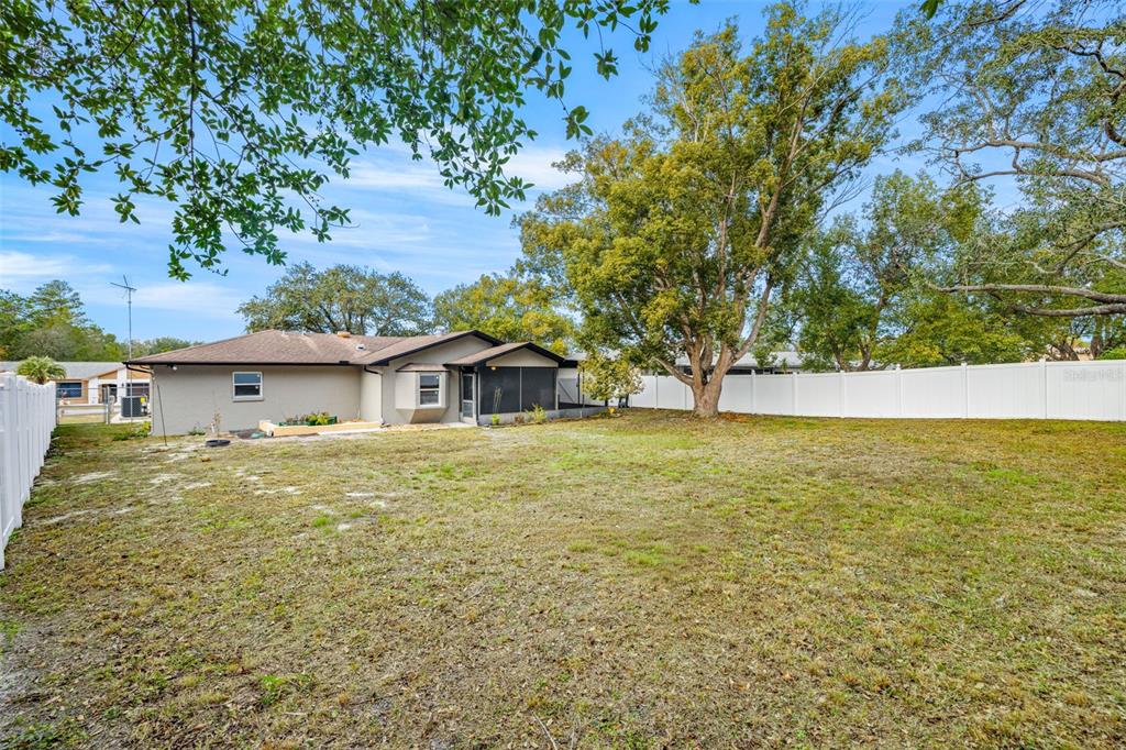8082 Pagoda Drive Spring Hill, FL 34606 - Photo 26 of 28 a view of a house with a yard