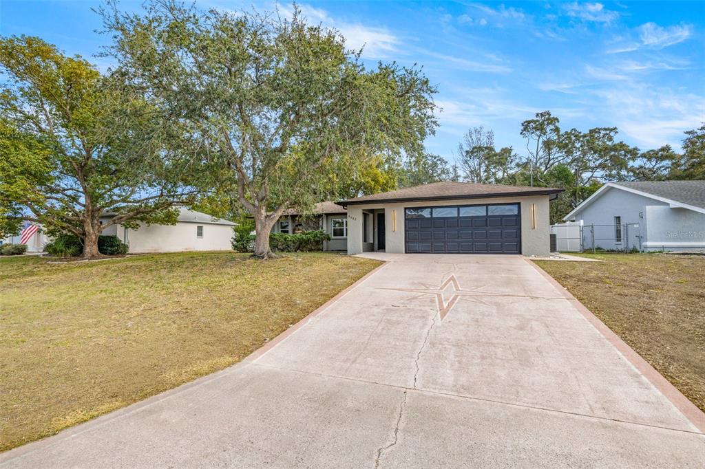 8082 Pagoda Drive Spring Hill, FL 34606 - Photo 28 of 28 a house with trees in front of it