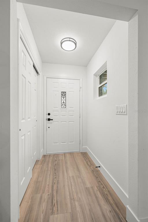 8082 Pagoda Drive Spring Hill, FL 34606 - Photo 3 of 28 a view of a room with wooden floor