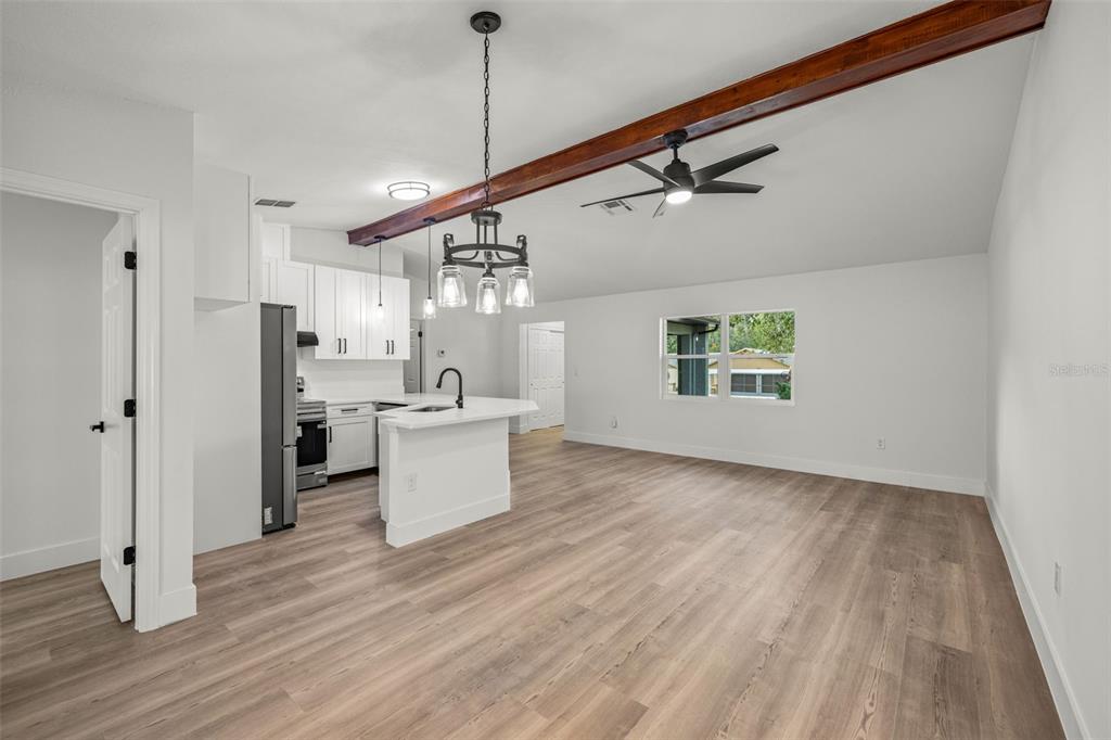 8082 Pagoda Drive Spring Hill, FL 34606 - Photo 6 of 28 a view of a kitchen with a sink and wooden floor