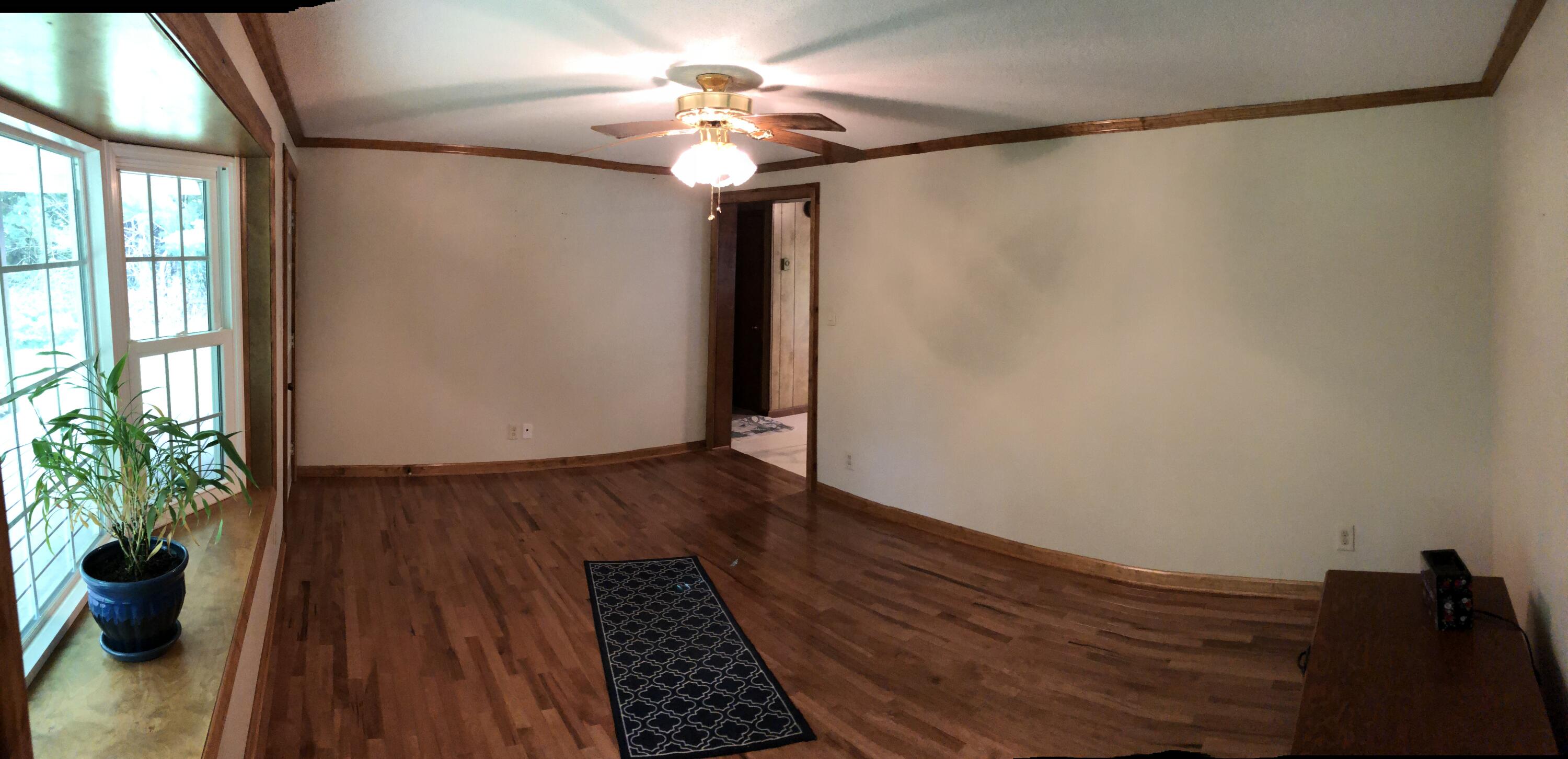 1613 Kings Store Road Northeast Check, VA 24072 - Photo 3 of 25 a view of a hallway with wooden floor and a potted plant