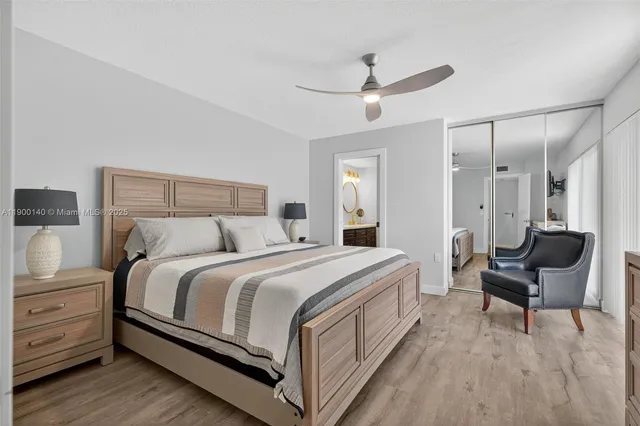 a bed room with a bed and a chair