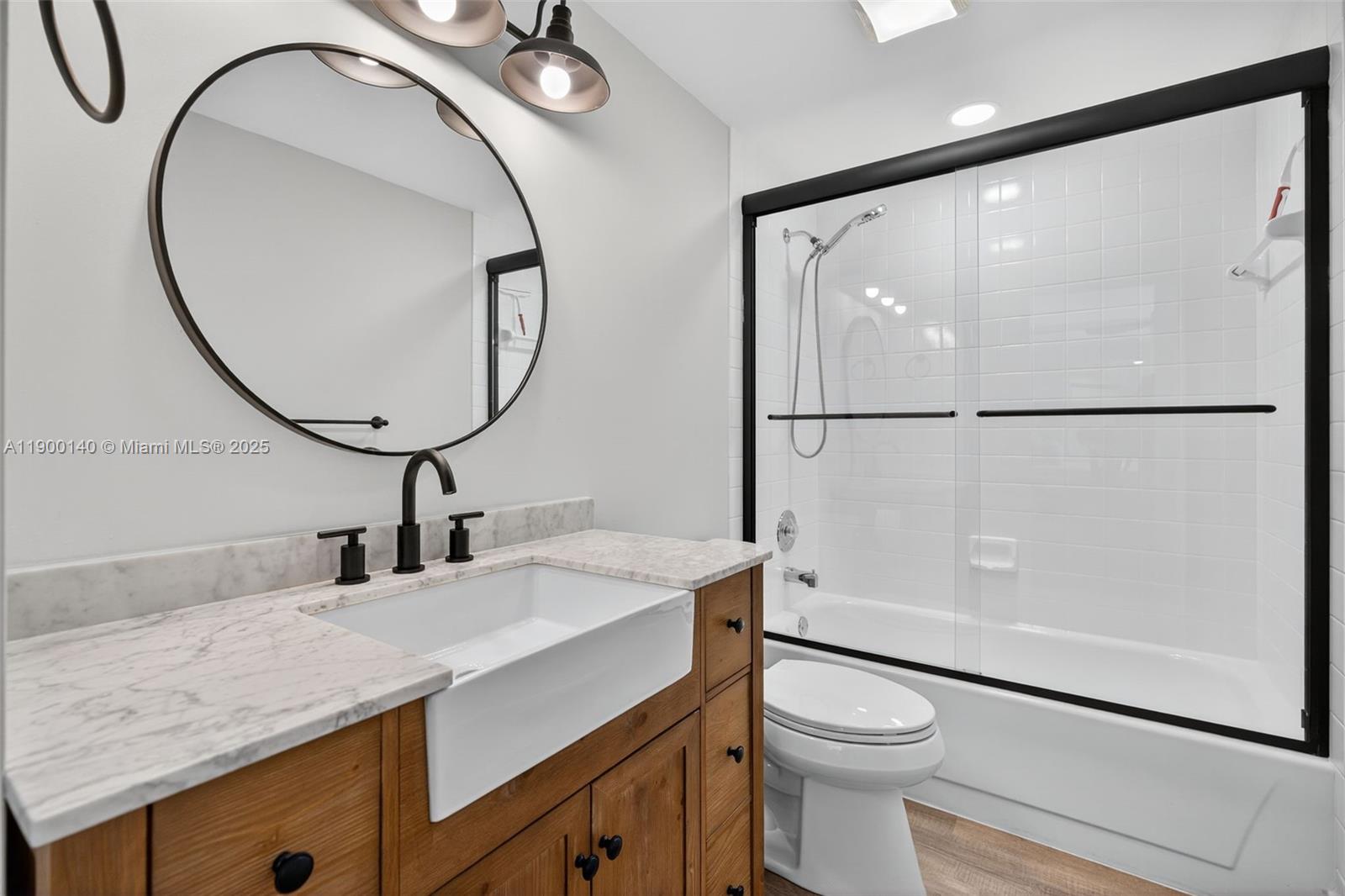 2701 27th Court, Unit 2701 Jupiter, FL 33477 - Photo 25 of 28 a bathroom with a sink a toilet and a mirror
