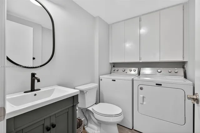 a view of bathroom with a sink and a mirror
