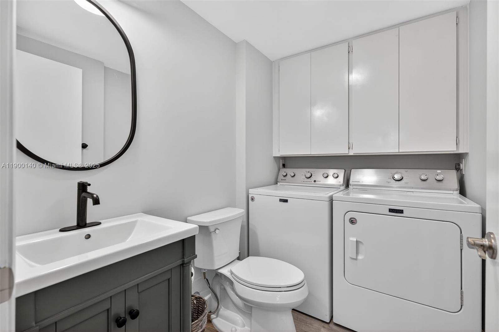 2701 27th Court, Unit 2701 Jupiter, FL 33477 - Photo 26 of 28 a view of bathroom with a sink and a mirror