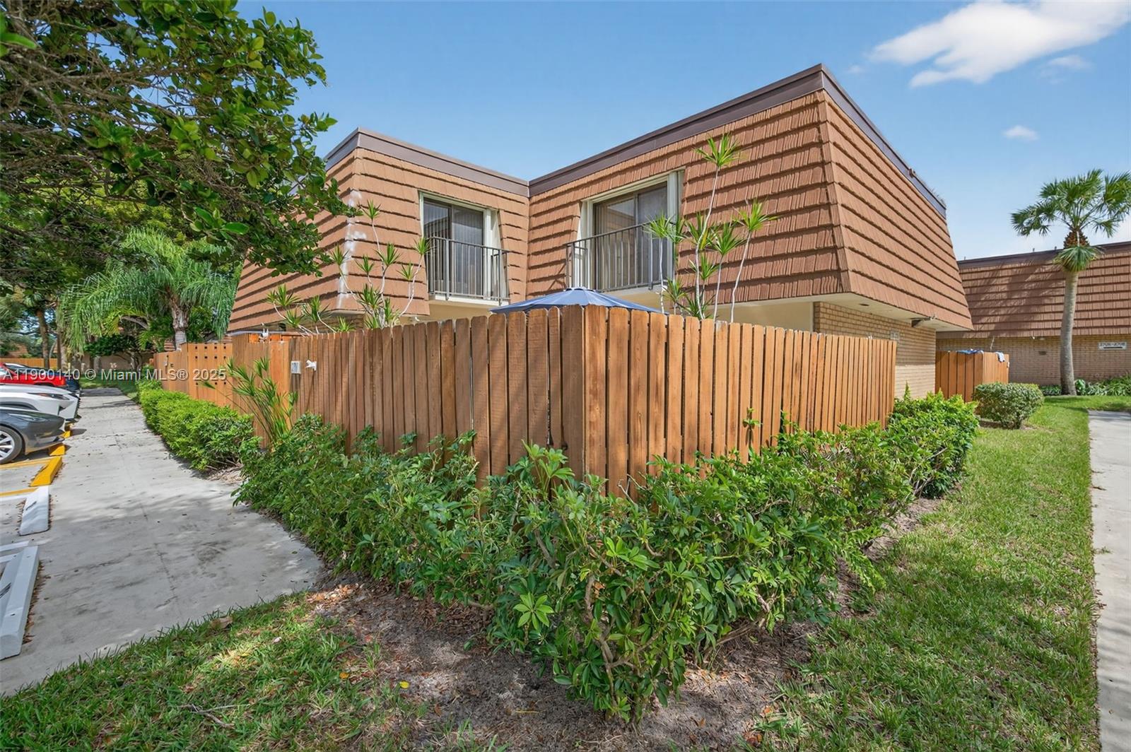 2701 27th Court, Unit 2701 Jupiter, FL 33477 - Photo 28 of 28 a front view of a house with garden