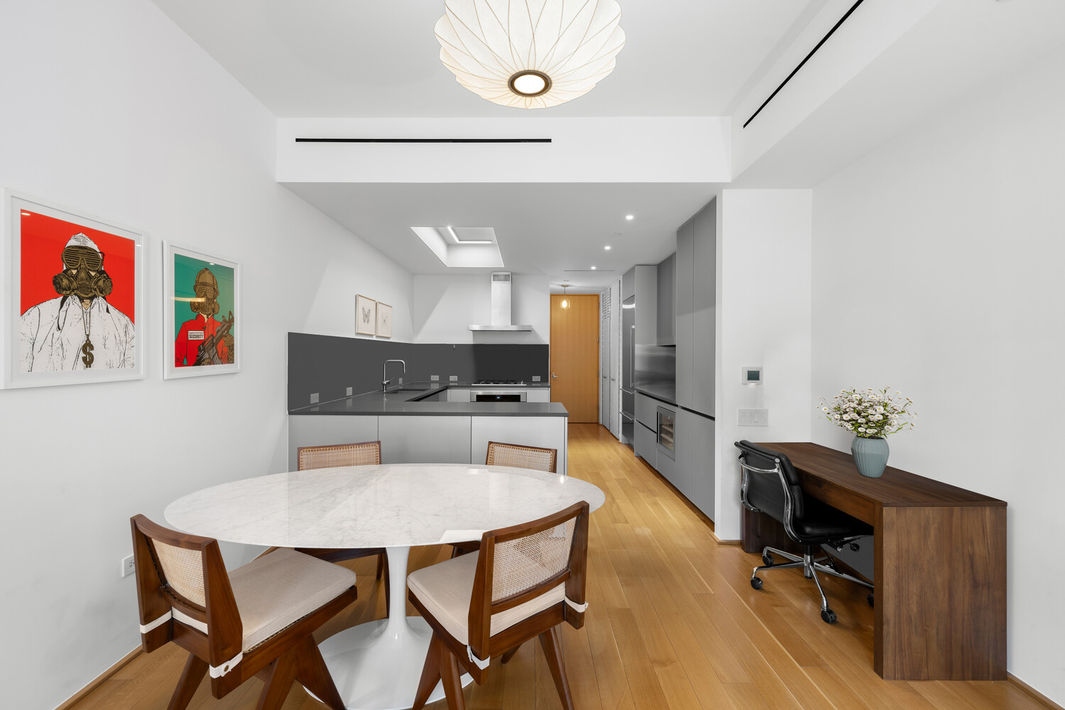 71 Reade Street, Unit 4C Manhattan, NY 10007 - Photo 3 of 12 a kitchen with a table and chairs in it
