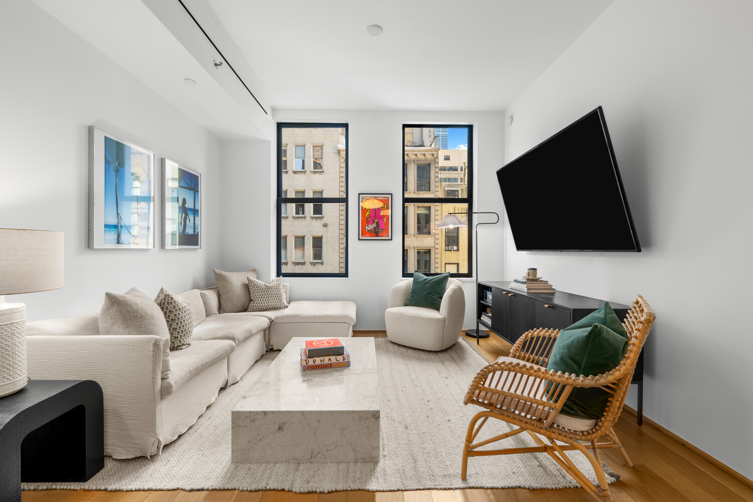 71 Reade Street, Unit 4C Manhattan, NY 10007 - Photo 4 of 12 a living room with furniture and a flat screen tv