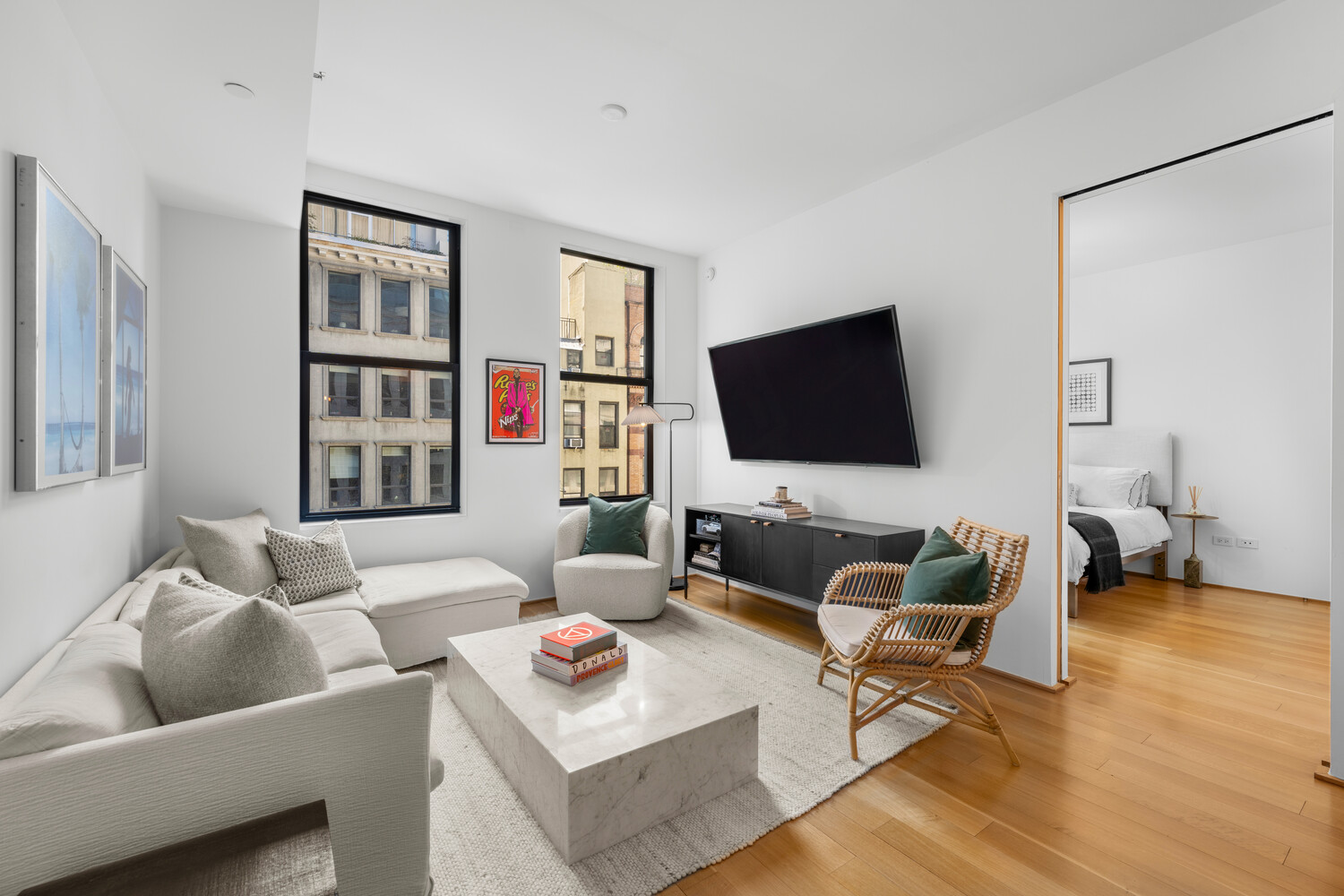 71 Reade Street, Unit 4C Manhattan, NY 10007 - Photo 5 of 12 a living room with furniture and a flat screen tv